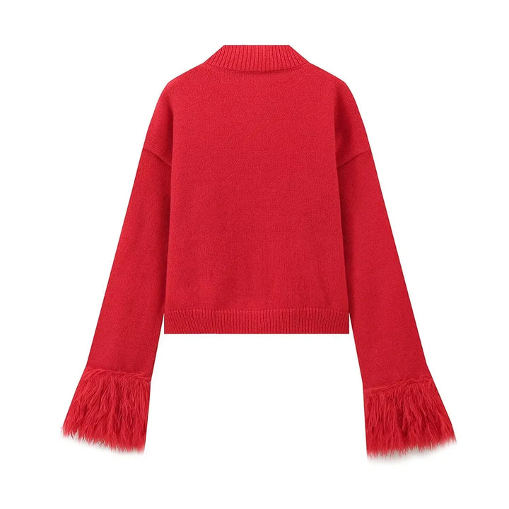 Back view of the red knit cardigan with feather cuffs on a white background