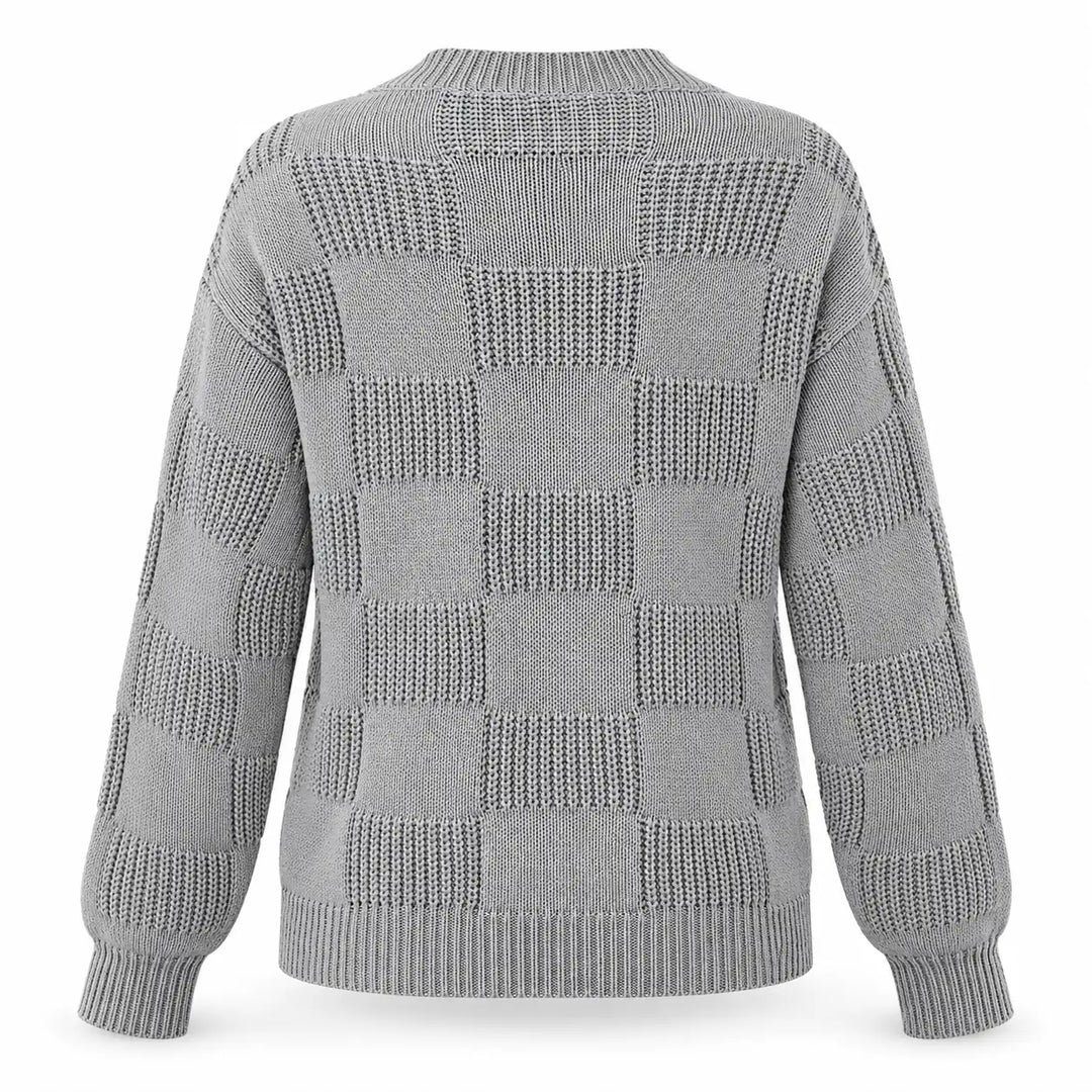 Back view of the gray openwork checkerboard knit sweater