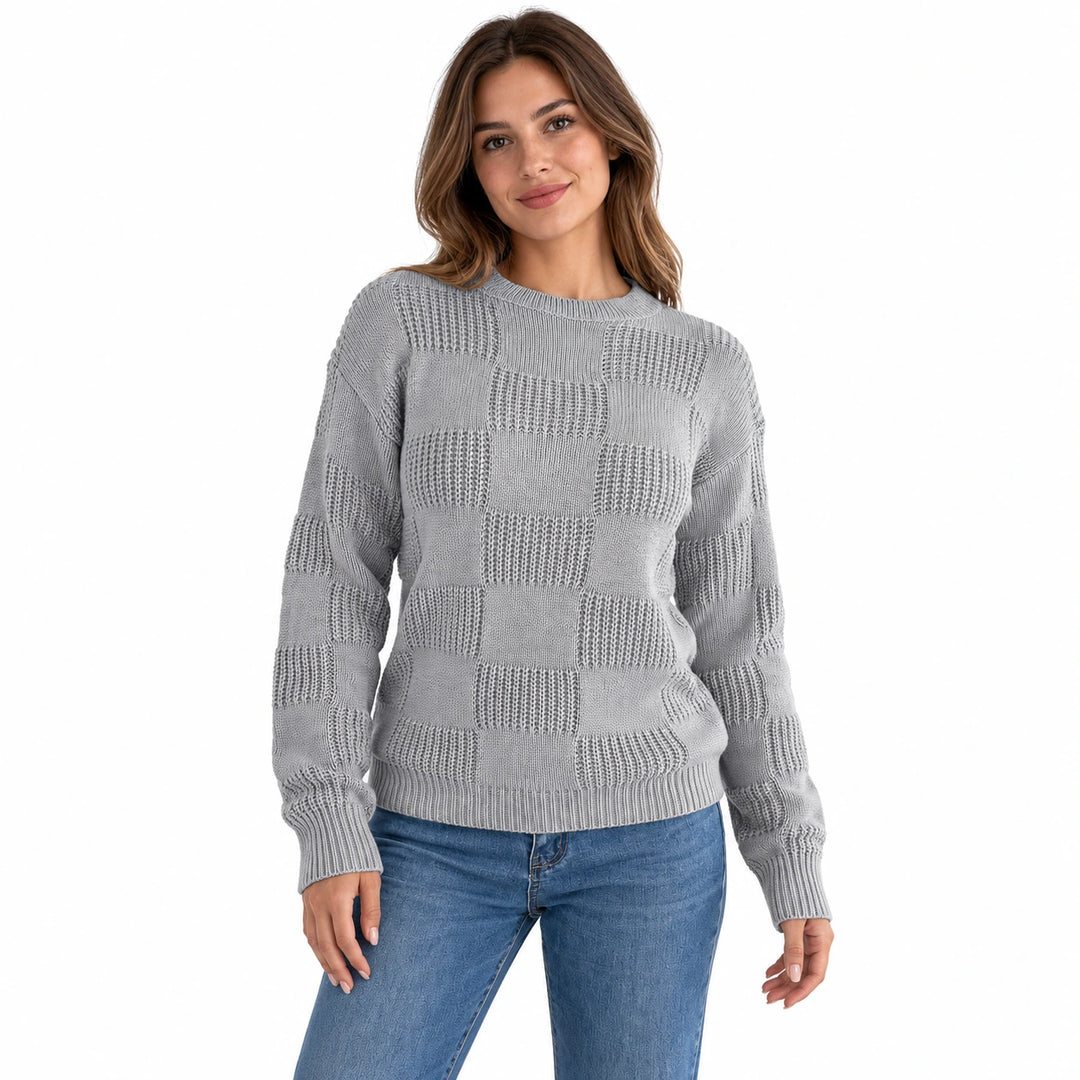 Model wearing the gray checkerboard knit sweater with blue jeans