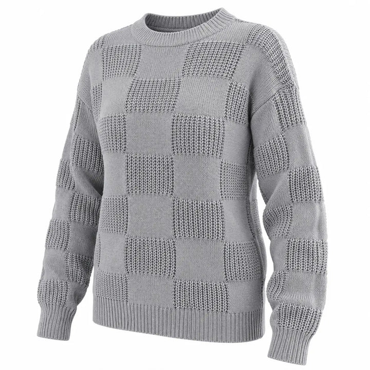 Three-quarter view of the gray checkerboard knit sweater showing its shape and knit texture