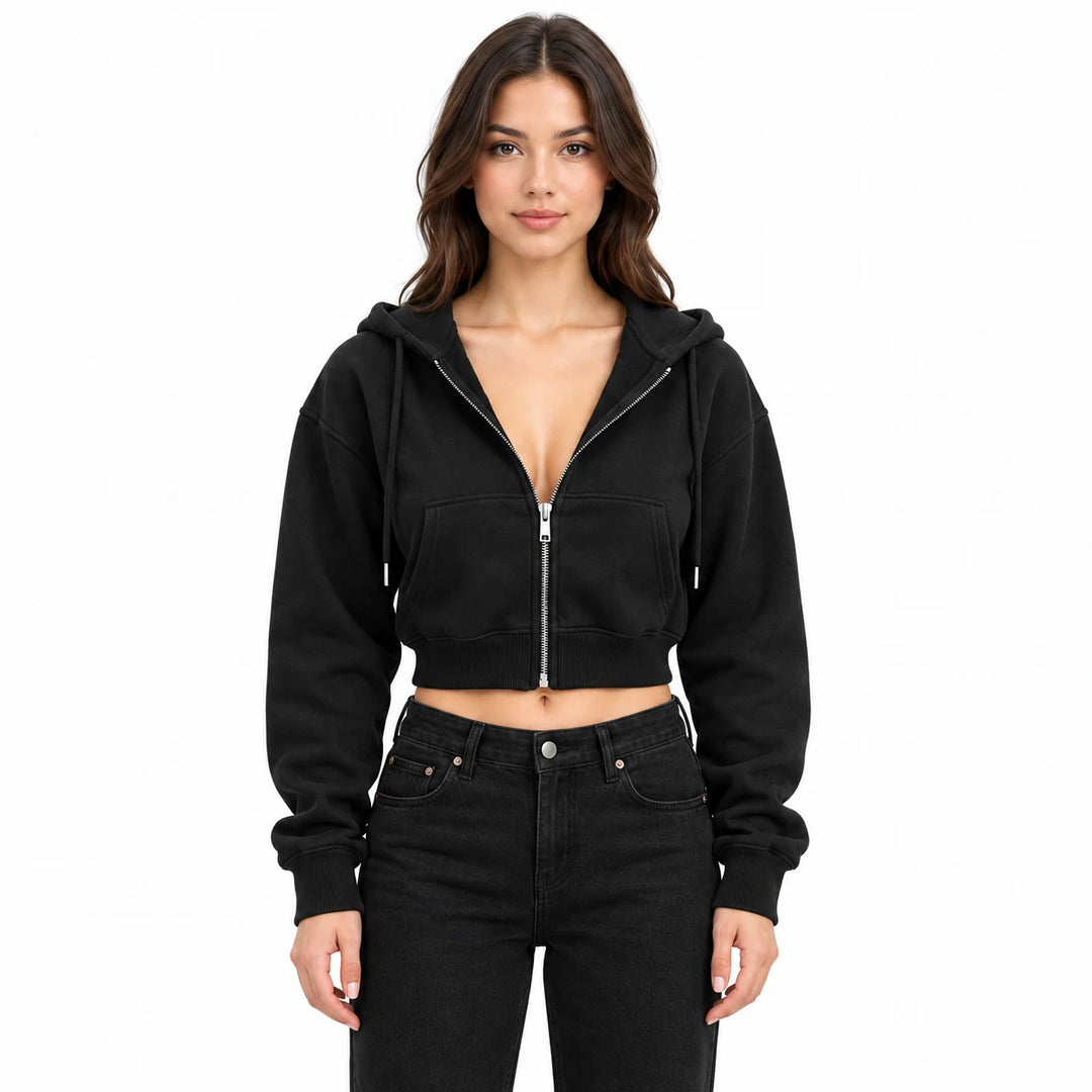 Black hoodie on an adult model in an upper-body studio view, with split front pockets, long sleeves and a cropped ribbed hem.