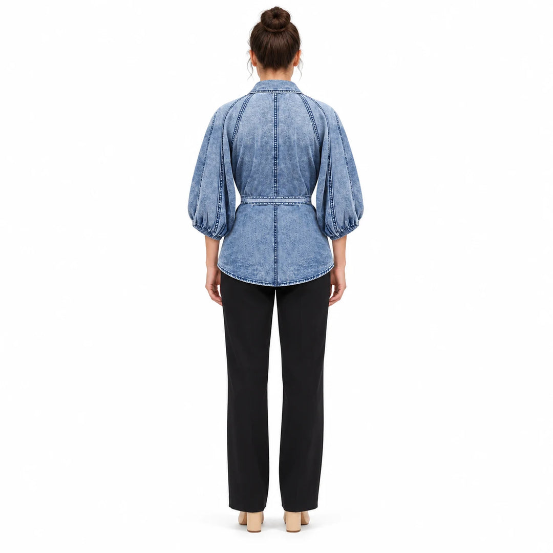 Washed Blue T0308 blouse on an adult model from the back, showing raglan seams, gathered sleeve cuffs and the waist tie band.