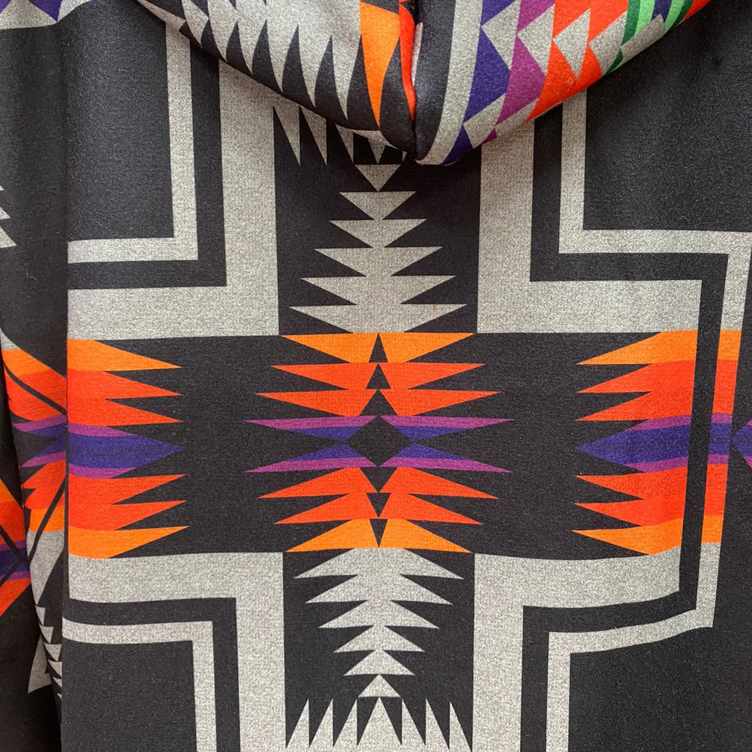 Original supplier close-up of the gray, navy, orange and purple geometric print.