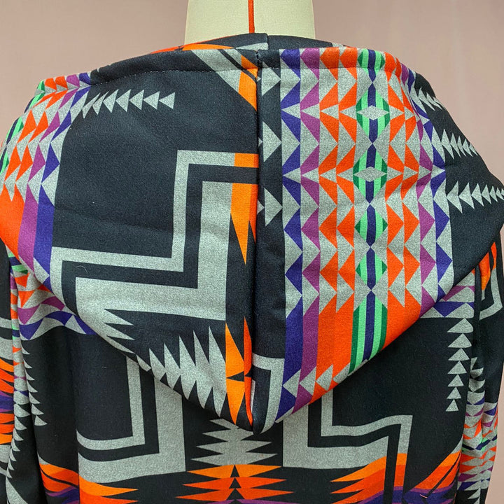 Original supplier close-up of the geometric coat hood and upper back.
