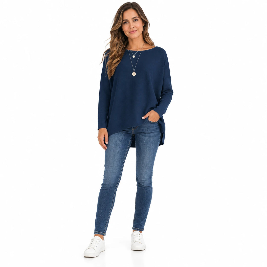 Adult woman wearing the Navy Blue batwing sleeve pullover, in a full-body front view against a plain white studio background.