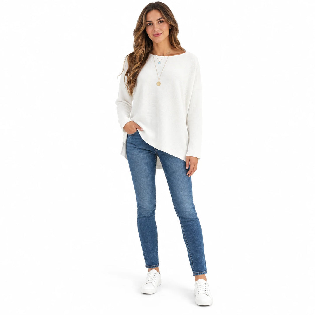 Adult woman modelling the White batwing sleeve pullover, in a full-length front view against a plain white studio background.
