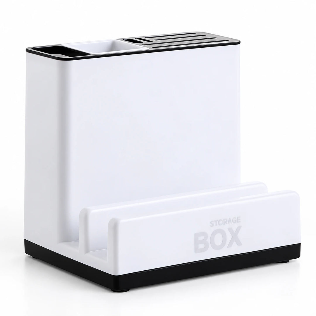 Empty white plastic organizer on a white studio surface, showing the upper storage slots, front shelf and dark base on white.