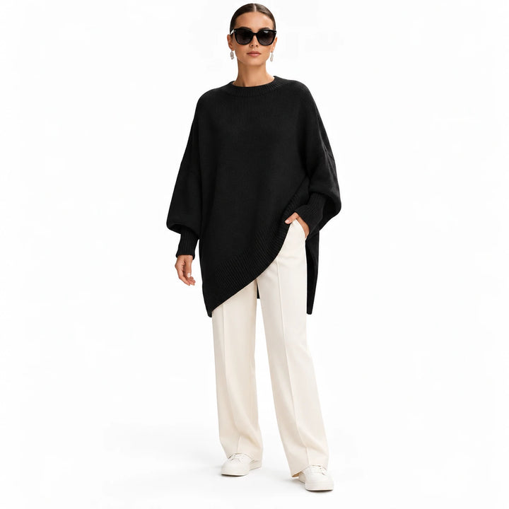 Adult woman wearing the Black round-neck draped pullover, in a full-body studio view against a plain white studio background.