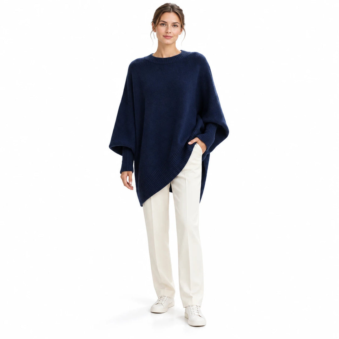 Adult woman wearing the Navy Blue round-neck draped pullover, in a front studio pose against a plain white studio background.