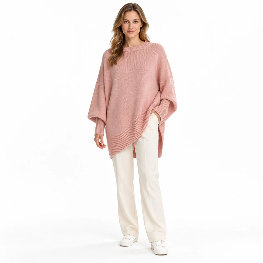 Adult woman wearing the Pink round-neck draped pullover, in a full-length front view against a plain white studio background.