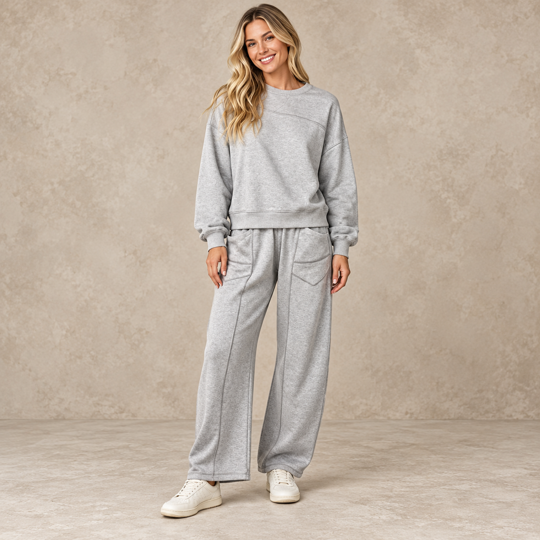 Gray sweatshirt and wide-leg trouser set with front patch pockets, shown full length on a model