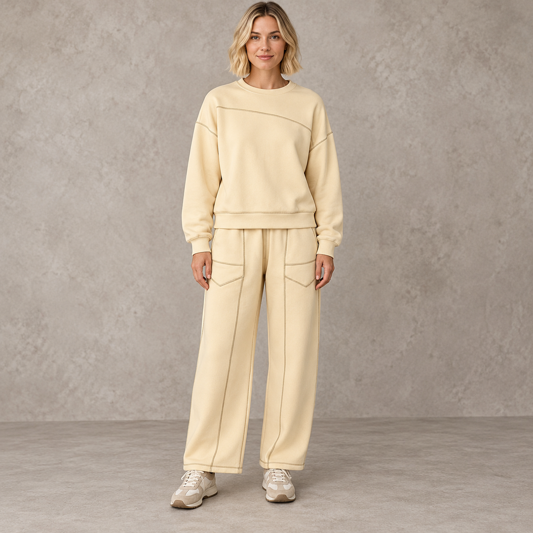 Apricot sweatshirt and wide-leg trouser set with front patch pockets on a full-length model