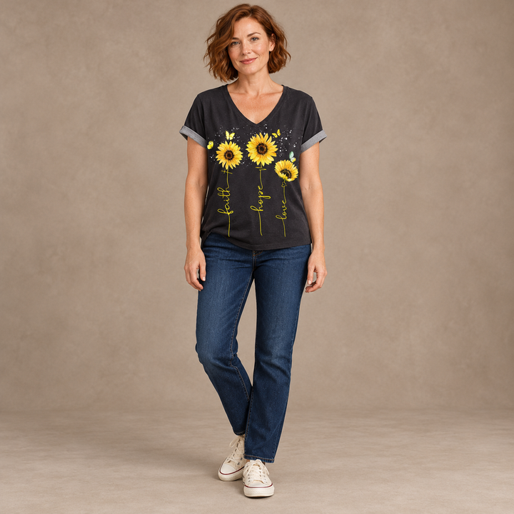 Black sunflower V-neck T-shirt with gray sleeve edges, worn by a full-length model with short auburn hair
