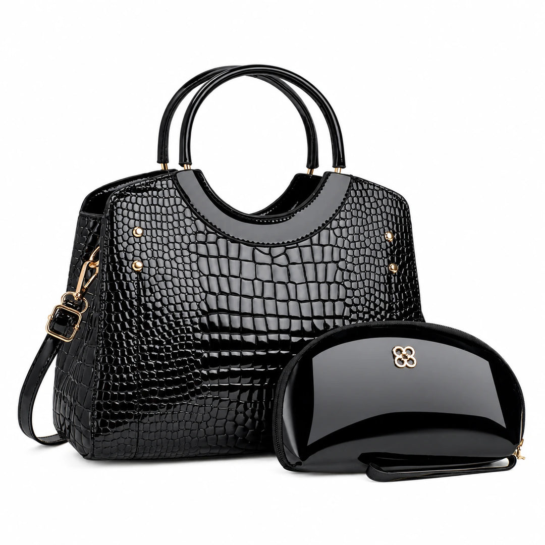 Three-quarter view of the black handbag with its matching pouch and visible side strap.
