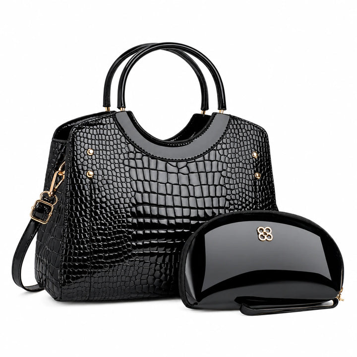Three-quarter view of the black handbag with its matching pouch and visible side strap.