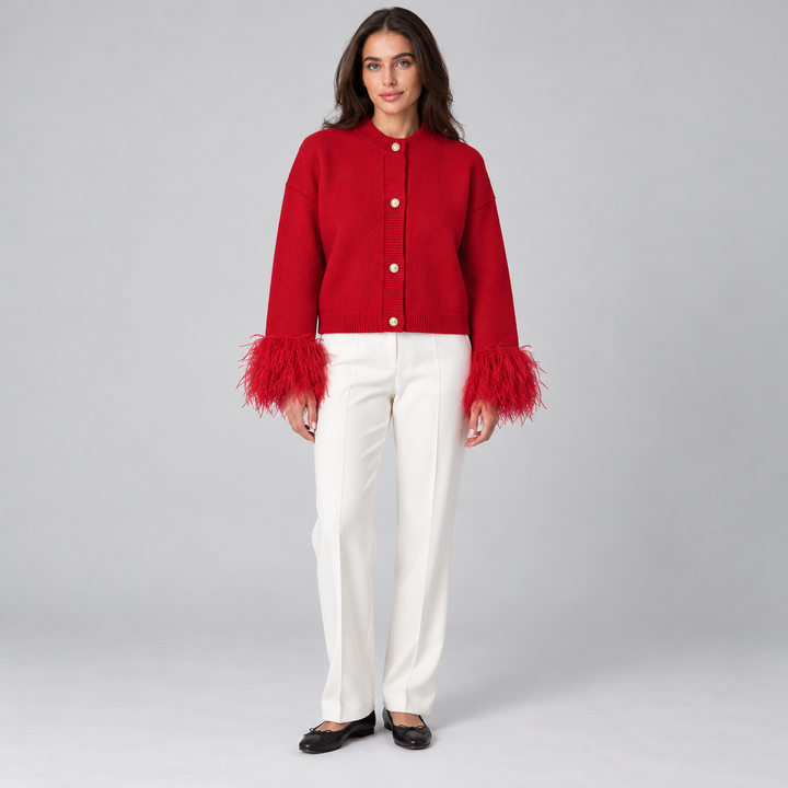 Full-body front view of the red feather-cuff cardigan with four gold-tone buttons
