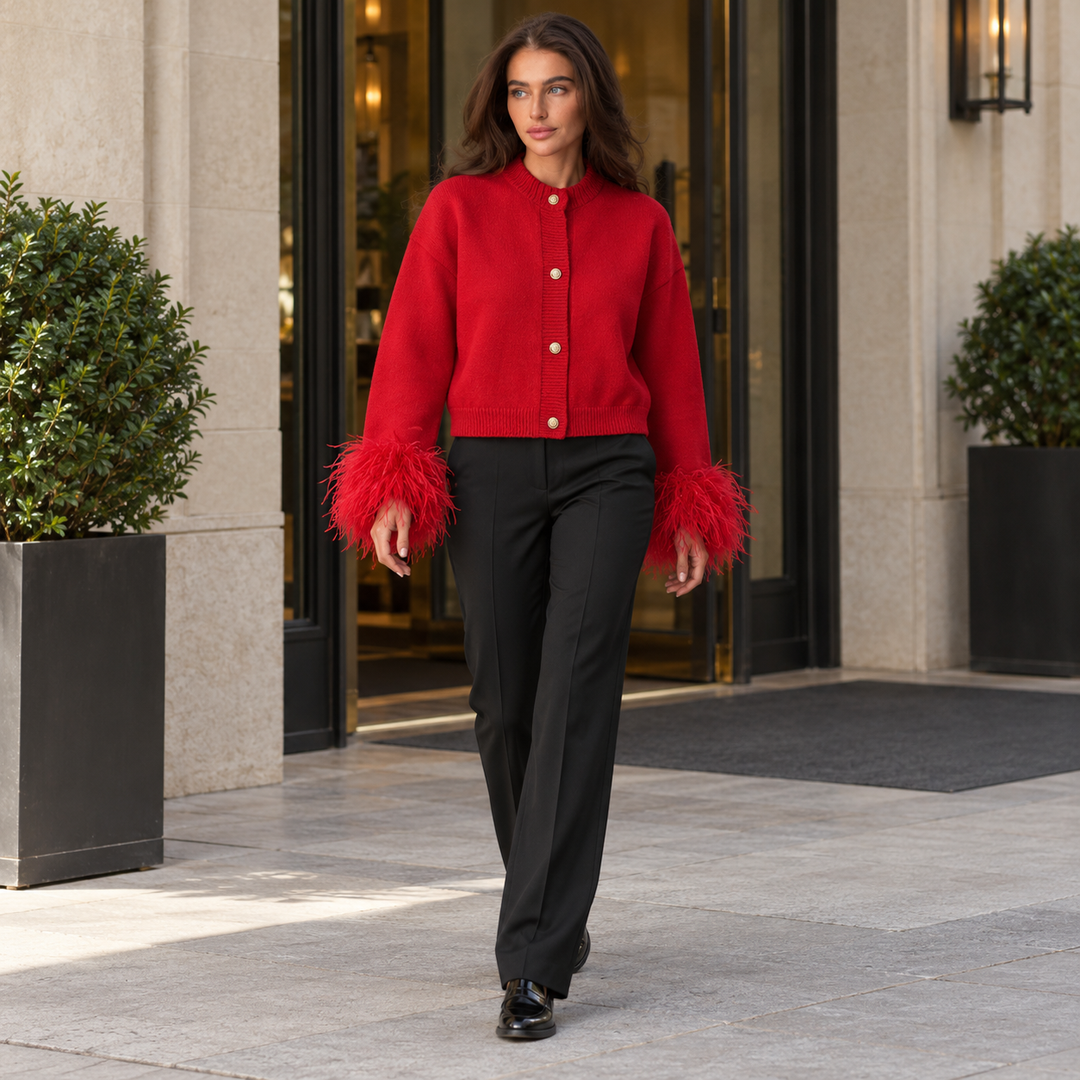 Full-body model walking in a red feather-cuff cardigan with four gold-tone buttons