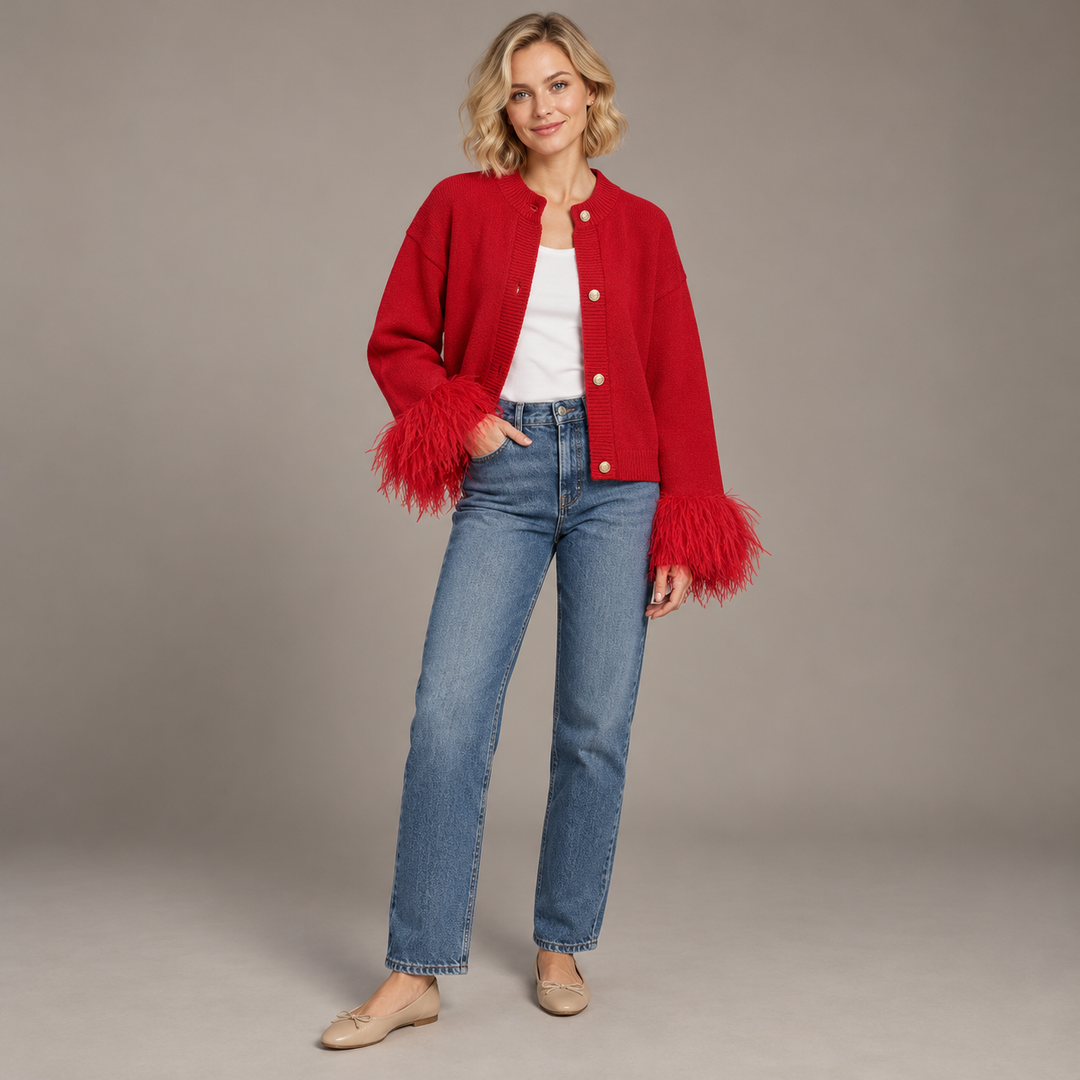 Full-body blonde model wearing the red feather-cuff cardigan open with a white top and jeans