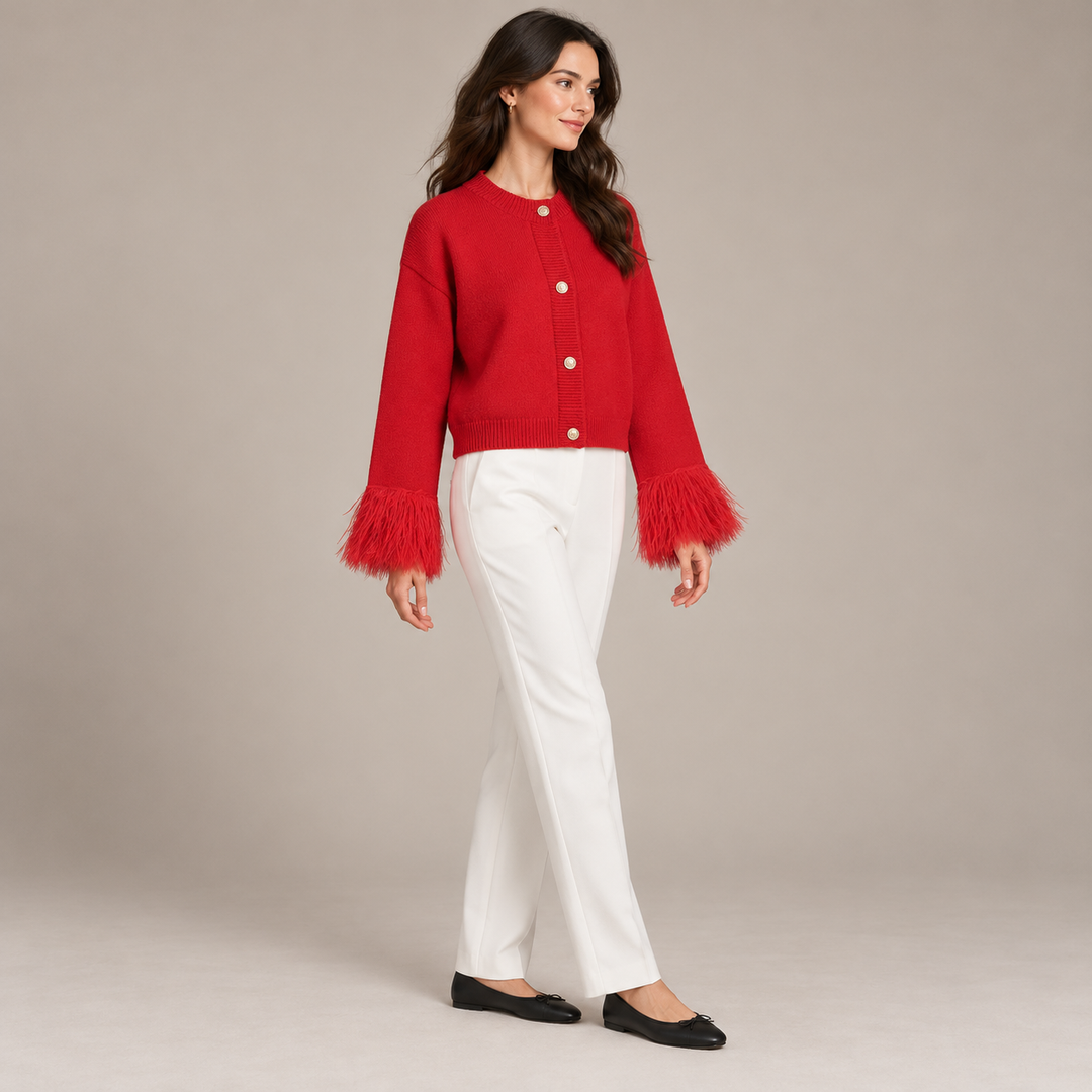 Full-body three-quarter view of the red cardigan with feather cuffs
