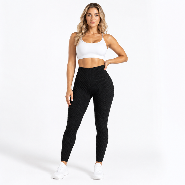 Scrunch leggings women in black shown from the front on an adult model, with high waist and textured activewear finish.