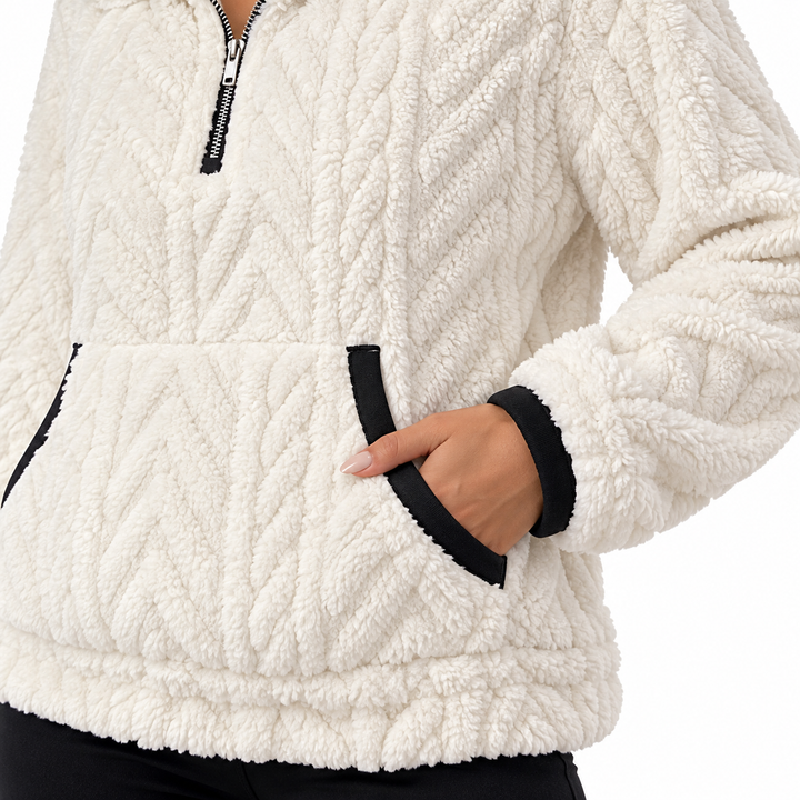 Close-up of a hand in white pullover&