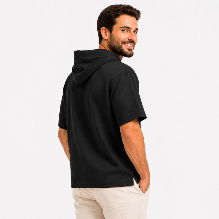 Rear close view of a black short sleeve hoodie showing the hood, shoulder line, sleeve, and hem.