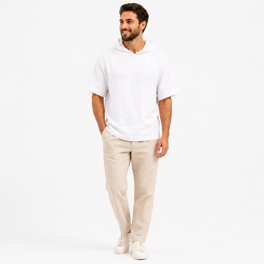 Man wearing a white short sleeve pullover hoodie, full-body front view on a clean white background.
