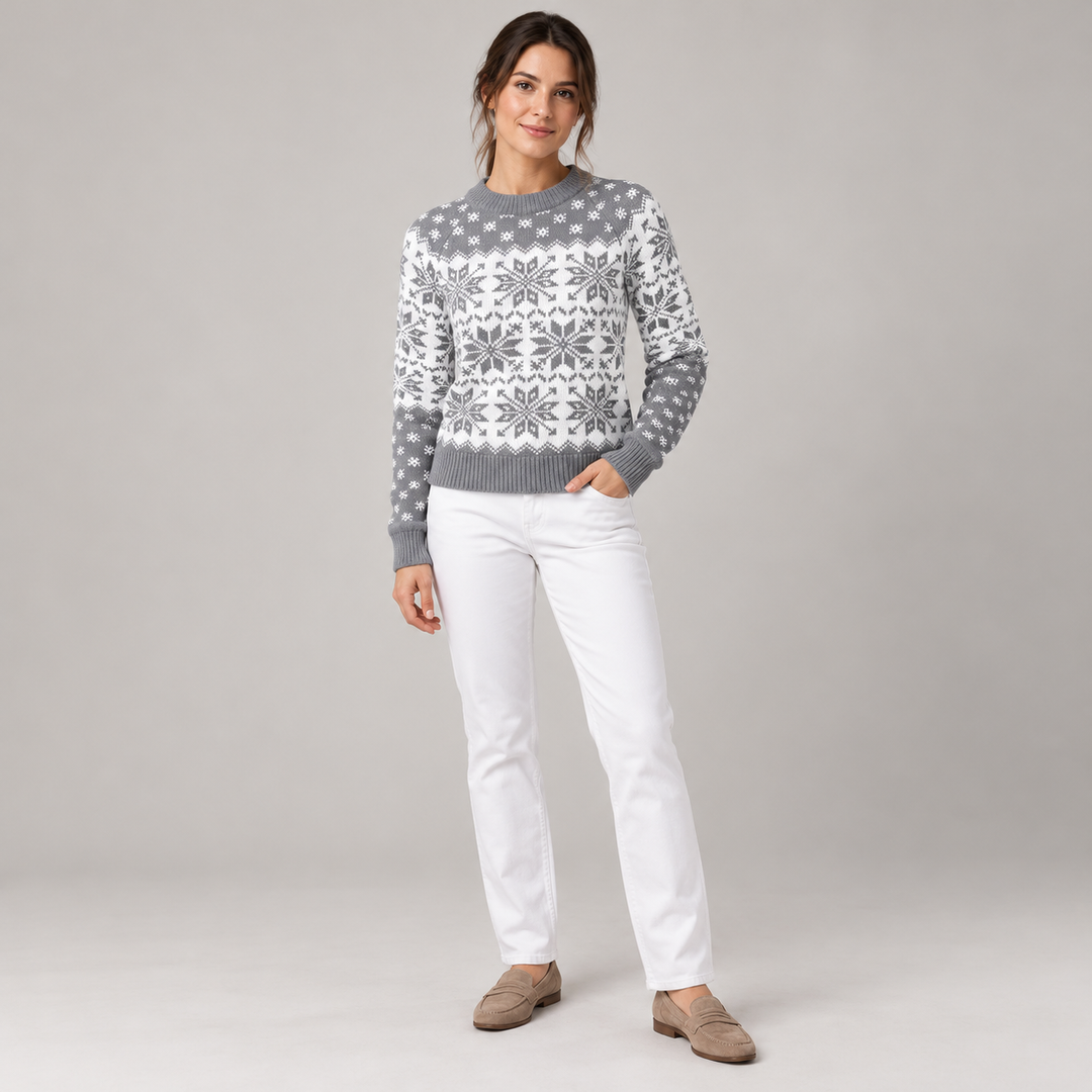 Full-body model wearing the gray and white snowflake sweater in a neutral studio