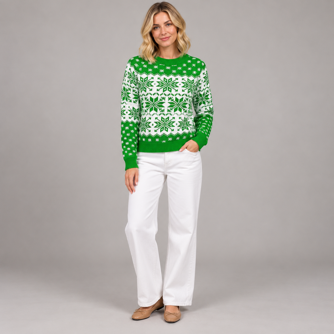 Full-body blonde model in the green and white snowflake knit sweater