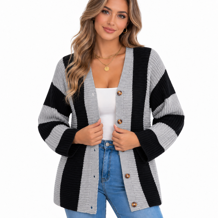 Close view of the grey and black striped cardigan highlighting the chunky knit texture and round brown buttons