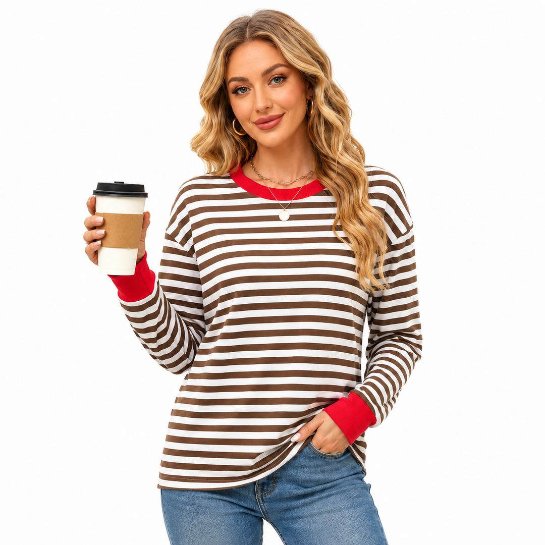 Striped long sleeve top for women in brown and white stripes with red trim, styled with blue jeans and a coffee cup on white.