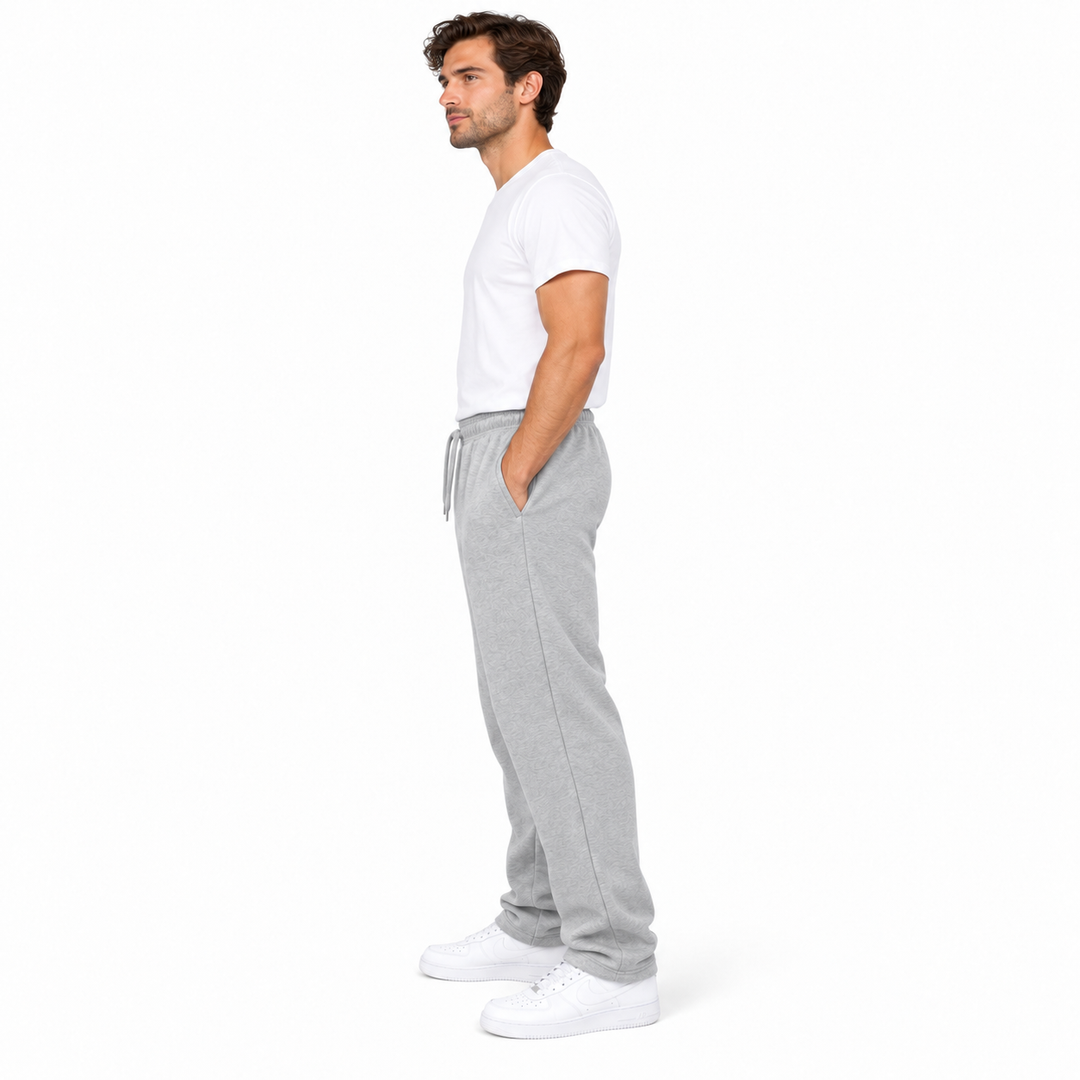 Light gray sweatpants side view on a full-body male model against a white background