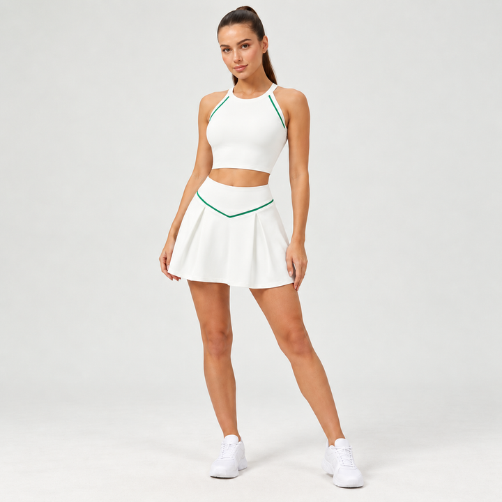 Tennis skirt in white with green V-waist trim on a full-body model