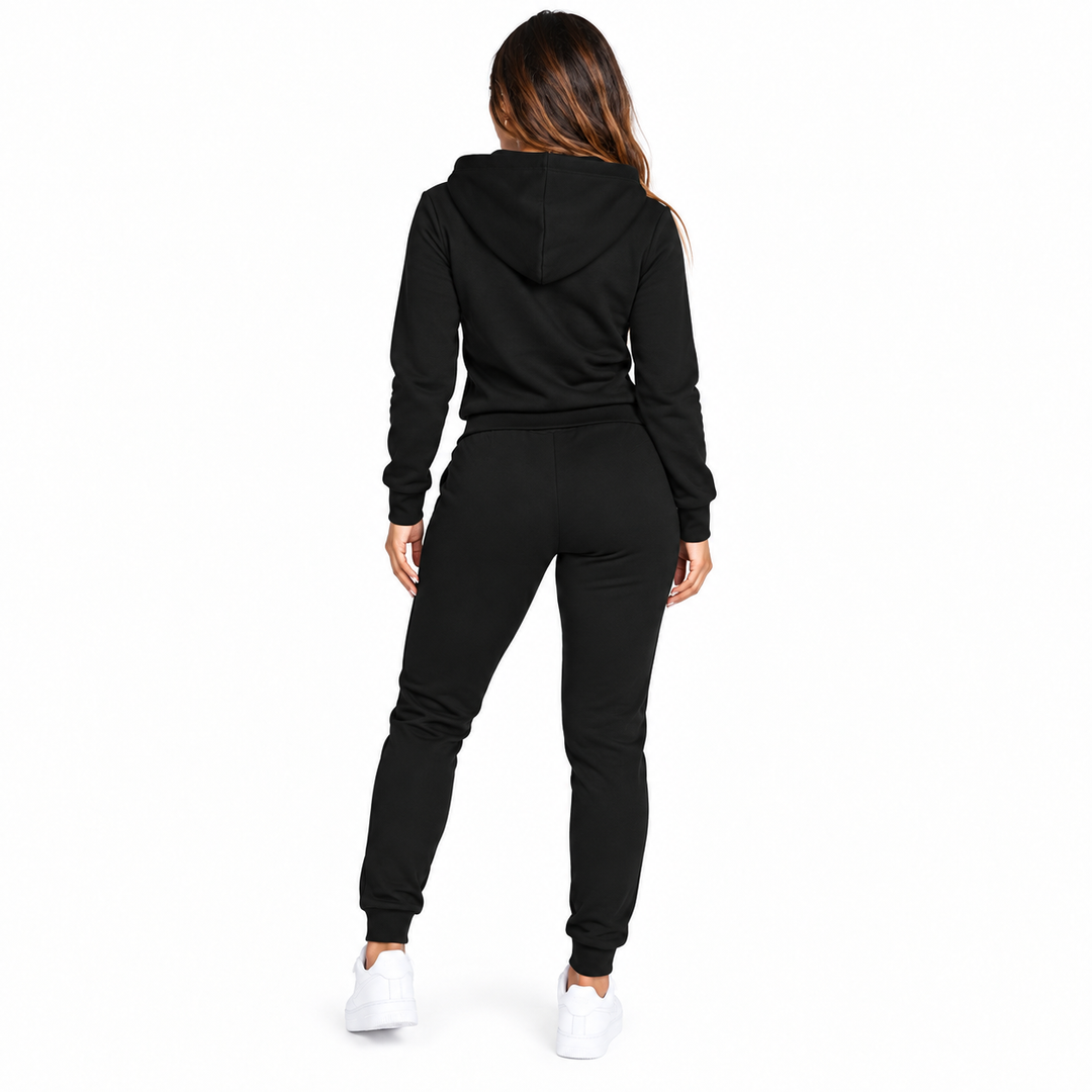 Black hooded tracksuit back view showing the coordinated top, jogger shape and cuffed ankles