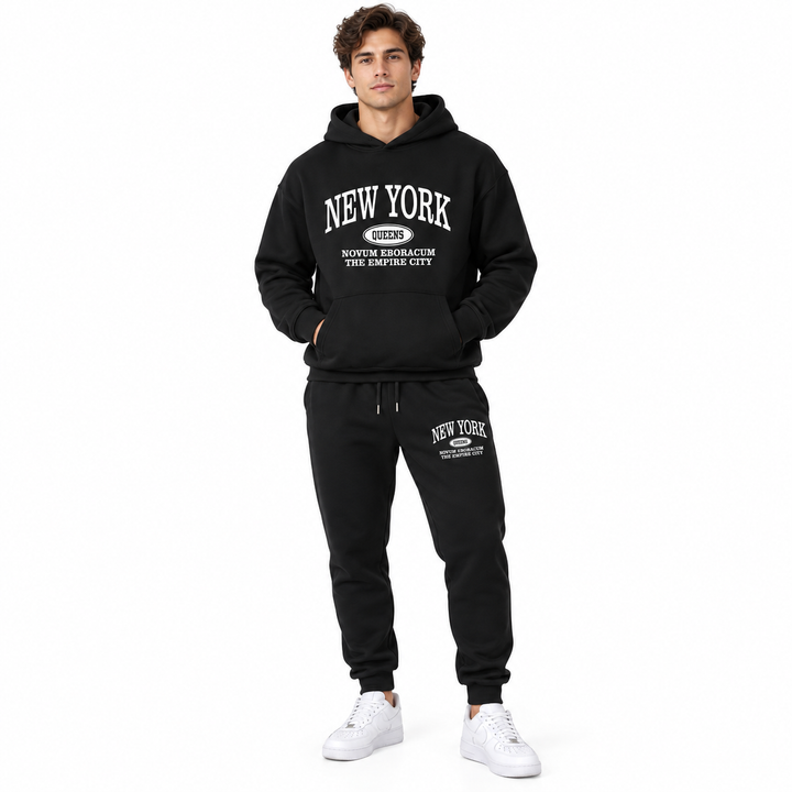 Unisex graphic sweatsuit set in black on a male model, full front view