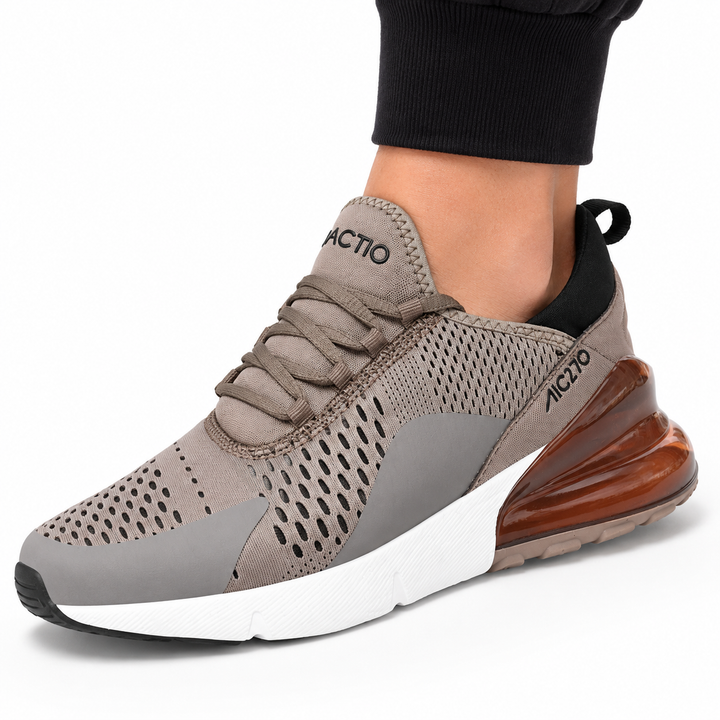 Close-up of brown Unisex Max Air running shoe showing the perforated upper, laces and visible heel unit.