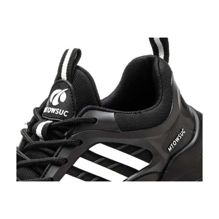 Close-up of flyknit upper detail on Black / White unisex safety shoes