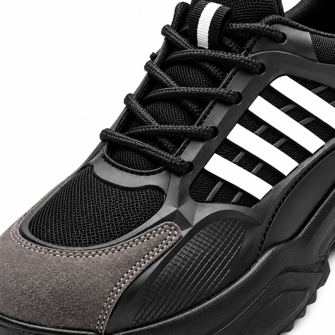 Close-up of Black / White safety shoe upper, laces, mesh texture and side details
