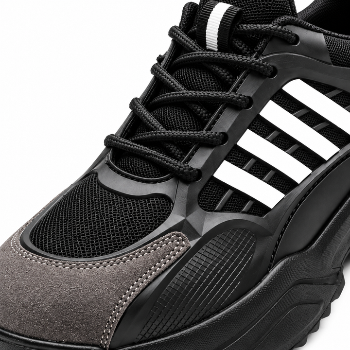 Close-up of Black / White safety shoe upper, laces, mesh texture and side details