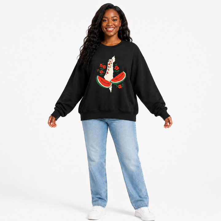 Black watermelon sweatshirt for women shown on a model with the loose silhouette and floral watermelon graphic clearly visible.