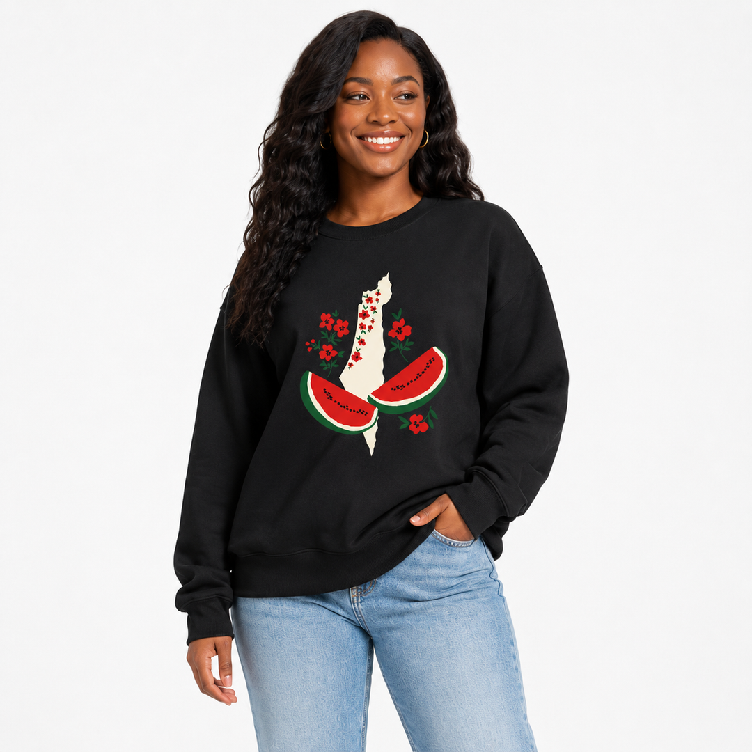 Black watermelon sweatshirt for women in a three-quarter model view showing the loose silhouette and floral watermelon front graphic.