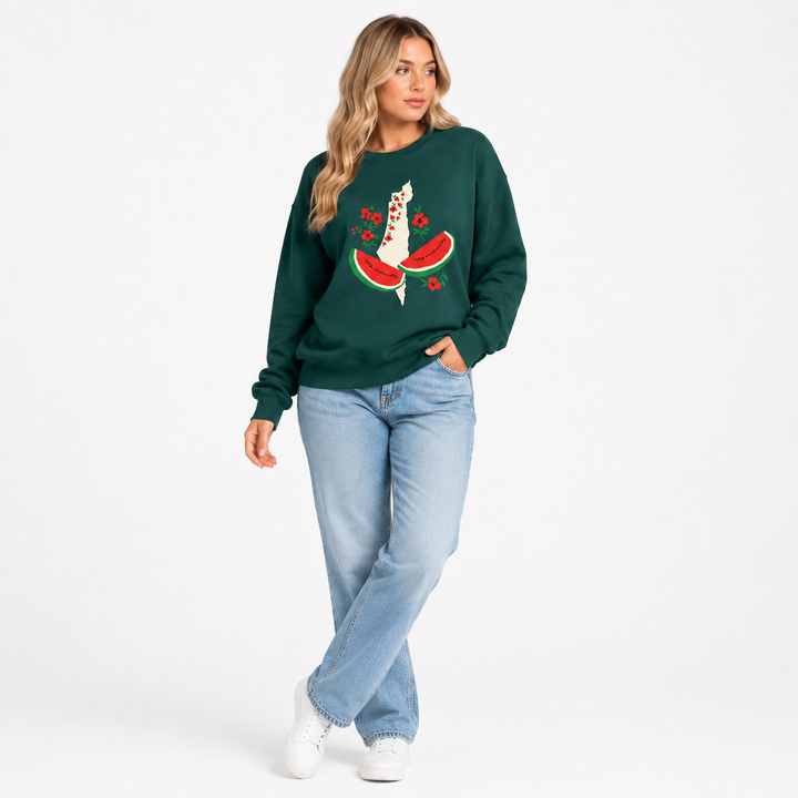 Dark green watermelon sweatshirt for women in a clean lifestyle model pose showing the loose fit and floral watermelon front graphic.