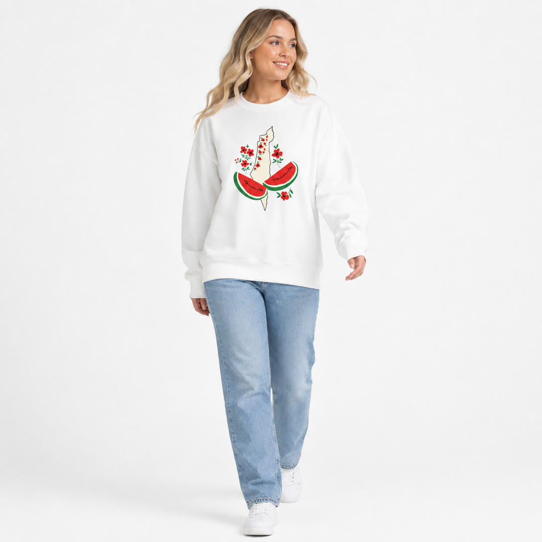 White watermelon sweatshirt for women shown on a walking model with loose fit and centered floral watermelon graphic on the front.