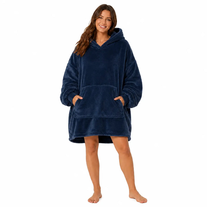 Navy Blue wearable blanket hoodie with hood and large front pocket modeled by a woman on a clean white studio background.