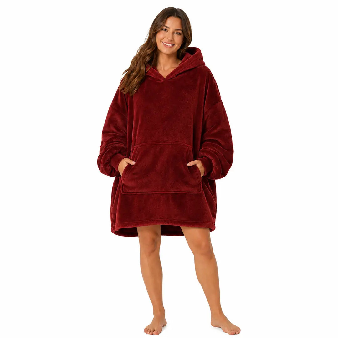 Wine Red wearable blanket hoodie with hood and large front pocket modeled by a woman on a clean white studio background.
