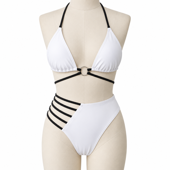 White bikini on a fabric display mannequin against white, showing the halter neck, central ring and black side strap details.