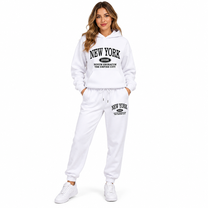 White graphic hoodie and sweatpants set on a female model, full front view