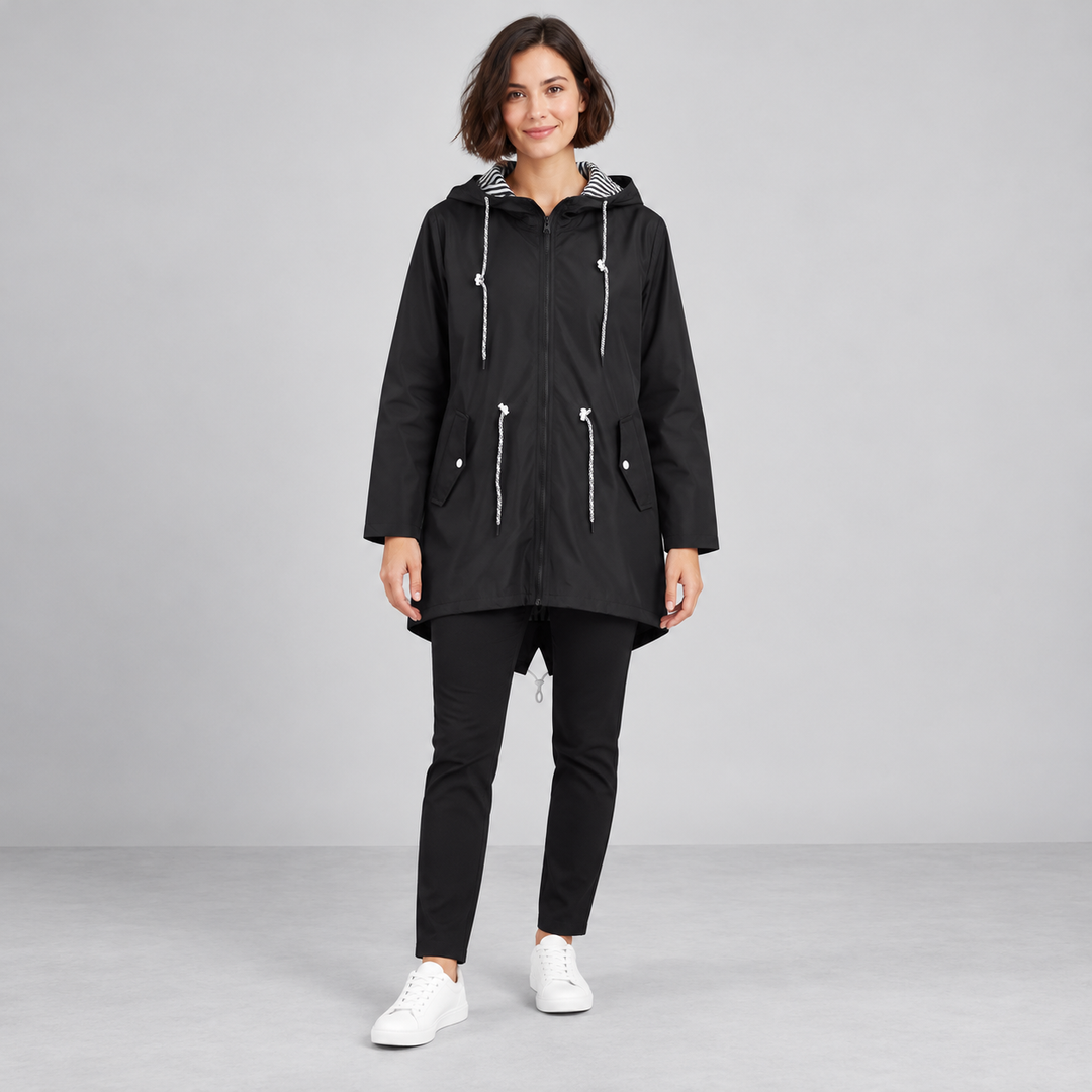 Full-body model wearing a black hooded zip-front windbreaker.