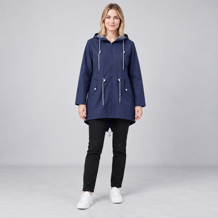 Full-body model wearing a dark blue hooded zip-front windbreaker.