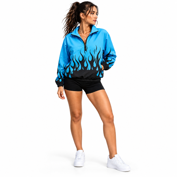 Woman wearing a blue and dark flame jacket in a three-quarter front pose, showing the collar facing and partial front zipper.